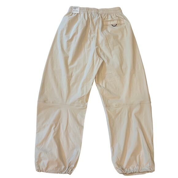 Nike Tech Woven Pants Mens Sz Medium Beige Oversized Straight Leg Stacked Length - Picture 2 of 12